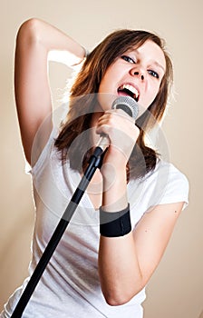 Rock female vocalist on gray background