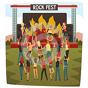Rock Fest, Open Air Concert, Rock Band Performing on Stage, People Dancing and Having Fun Outdoor Next to Scene With