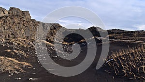 Rock fissure over the Mid Atlantic Ridge, where tectonic plates drift apart, near the Bridge Between Continents, Iceland.