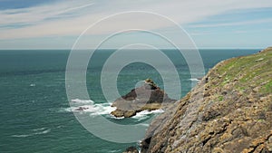 Rock Formation Attacked by Dramatic Waves, Small Rocky Island in Atlantic Ocean with Crashing Rough