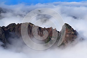 Rock formation in dense clouds on Pico do Arieiro. Madeira island