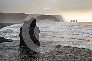 Rock formation at Dyrholaey at sunset, Iceland