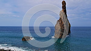 Rock formation IlhÃ©us da Ribeira da Janela on the coast of Madeira, Portugal in the rough Altantic Sea.