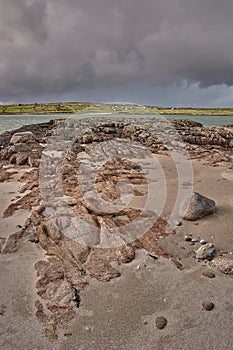 Rock formation on Omey Island, Ireland. Lonely beach in Ireland