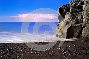 Rock formation on Praia Formosa beach on Portuguese island of Madeira