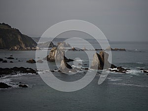 Rock formation sea stack at Playa del Silencio Gavieiro beach ocean coast shore cliffs Castaneras Asturias Spain Europe photo