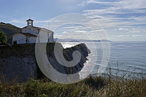 Rock formations on the coast of Zumaya, Spain, San Telmo Chapel photo