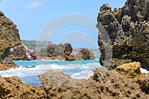 Rock formations eroded by the force of seawater. Textured rocks with the impact of the waves in Coqueirinho beach, Joao Pessoa, Br