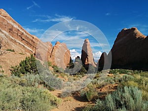 Rock formations with hill sloping downward at Arches National Park