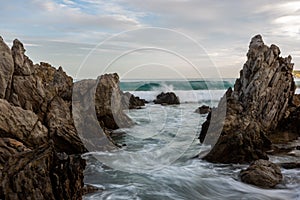 The rock formations and long exposure on the beach at Petrel Cove located on the Fleurieu Peninsula Victor Harbor South Australia