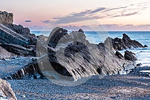 Rock formations on the north coast of Cornwall in the evening light after sunset