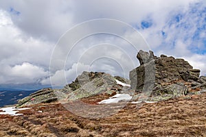 Rock formations with scenic view on alpine pasture seen from Steinerne Hochzeit in Saualpe mountains, Lavanttal Alps, Austria photo