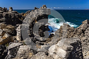 Rock formations in the site of geological interest of the cliffs of the Peniche peninsula, portugal, in a sunny day