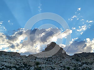 Rock Formations Surrounded by Blue Sky and Rays of Sunshine!