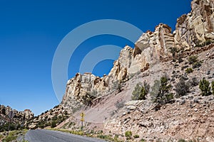 Rock formations tower above Burr Trail Road in the Grand Staircase-Escalante National Monument in Utah, USA