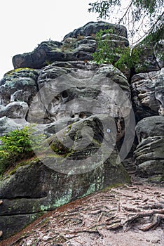 Rock formations with trail mark in Ostas rock city in CHKO Broumovsko in Czech republic