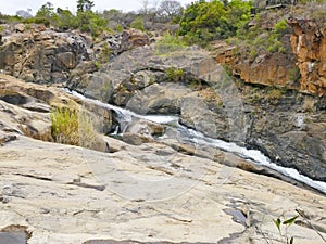 Rock Formations and Waterfall