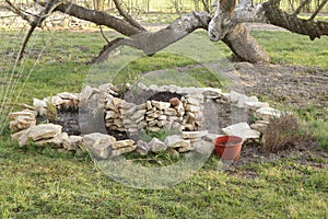 Rock garden made of white stone with herbs