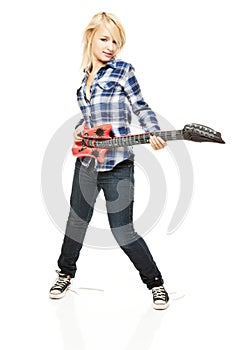 Rock girl with blow-up plastic guitar