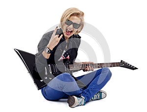 Rock girl playing an electric guitar