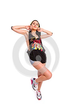 Rock girl with tattoos posing on a white background