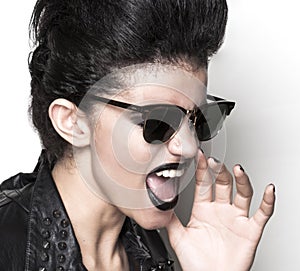 Rock girl wearing sunglasses half profile