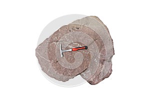 Rock hammer on red limestone rock isolated on white background.
