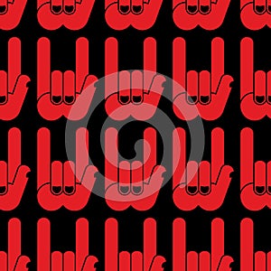 Rock hand sign seamless pattern. Black background and red hands.