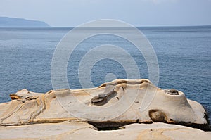 A rock having a shape of Fairy Shoe in Yehliu Geopark in a cape in Wanli District, New Taipei, Taiwan