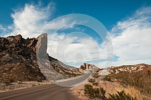 The rock and hills along a road with pale beds of volcanic ash in Big Bend National Park