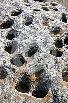 Rock with holes and water