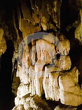 Rock inside chalk limestone stalactive cave stone water river formation light dark pai tour chiang mai thailand