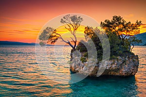 Rock island and Adriatic sea at sunset, Brela, Dalmatia, Croatia