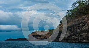 Rock Island over scenic blue sea water