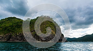 Rock Island over scenic blue sea water