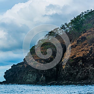 Rock Island over scenic blue sea water