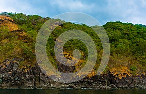 Rock Island over scenic blue sea water