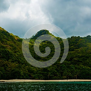 Rock Island over scenic blue sea water