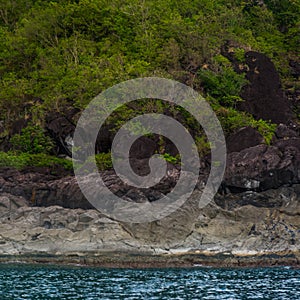 Rock Island over scenic blue sea water