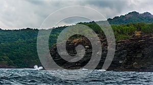 Rock Island over scenic blue sea water