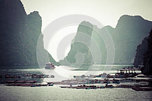 Rock islands near floating village in Halong Bay, Vietnam, Southeast Asia