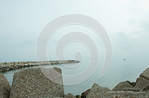 Rock jetty, protecting, Giulianova beach harbor entrance, Italy