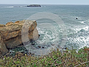 Rock Jutting Out Into Pacific Ocean photo