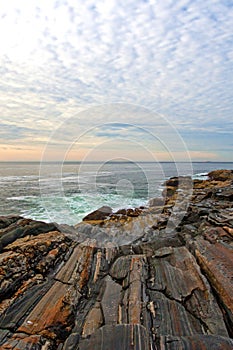 Rock ledges leading to sea at Pemaquid Point, Maine photo