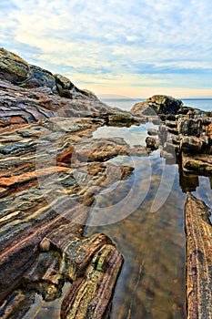 Rock ledges and tidal pools at Pemaquid Maine photo