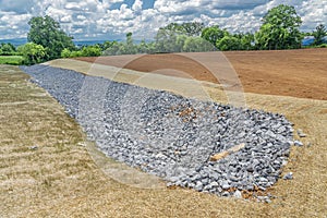 Rock Lined Drainage Ditch Under Construction photo
