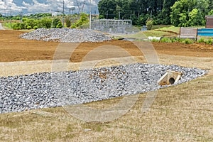 Rock Lining Drainage Ditch Under Construction