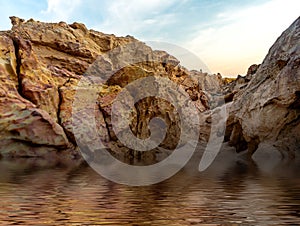 Rock mountain surrounding with water photo