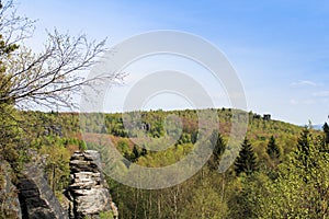 Rock mountain in Tisa overall view with trees and sky. Czech lan