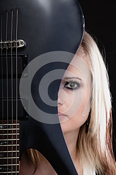 Rock music. Girl musician guitarist with electric guitar